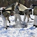 Cold-Weather Operations Course students practice building Arctic tent