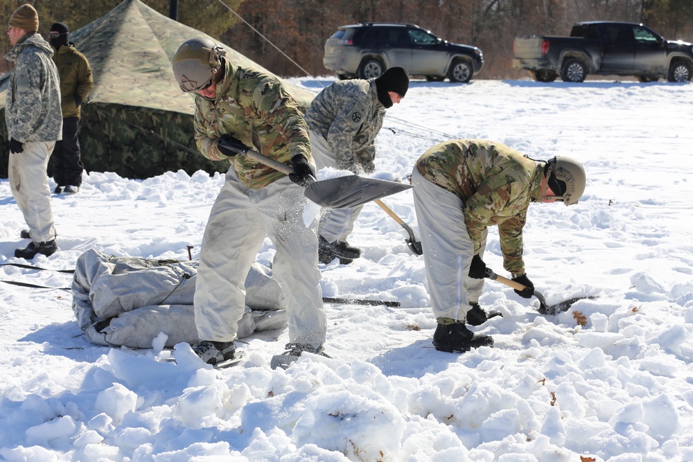 Cold-Weather Operations Course students practice building Arctic tent