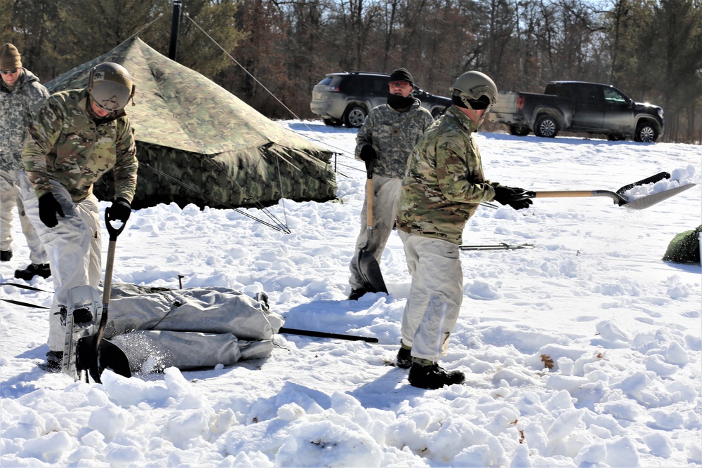 Cold-Weather Operations Course students practice building Arctic tent