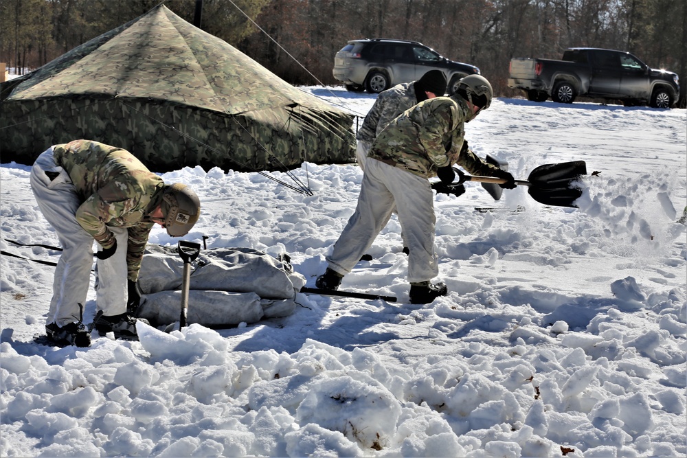 Cold-Weather Operations Course students practice building Arctic tent