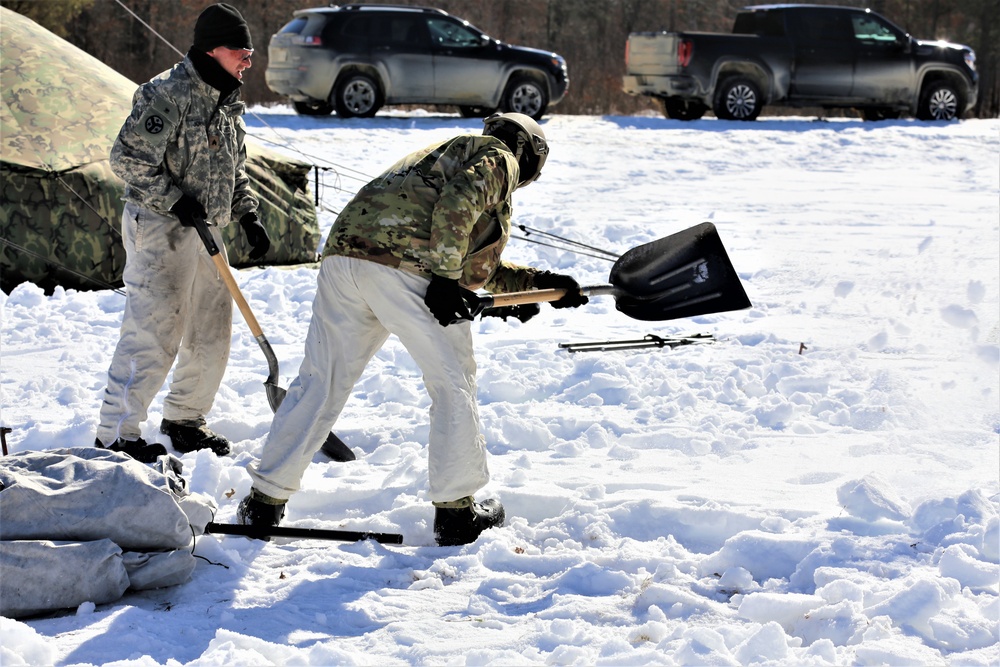 Cold-Weather Operations Course students practice building Arctic tent