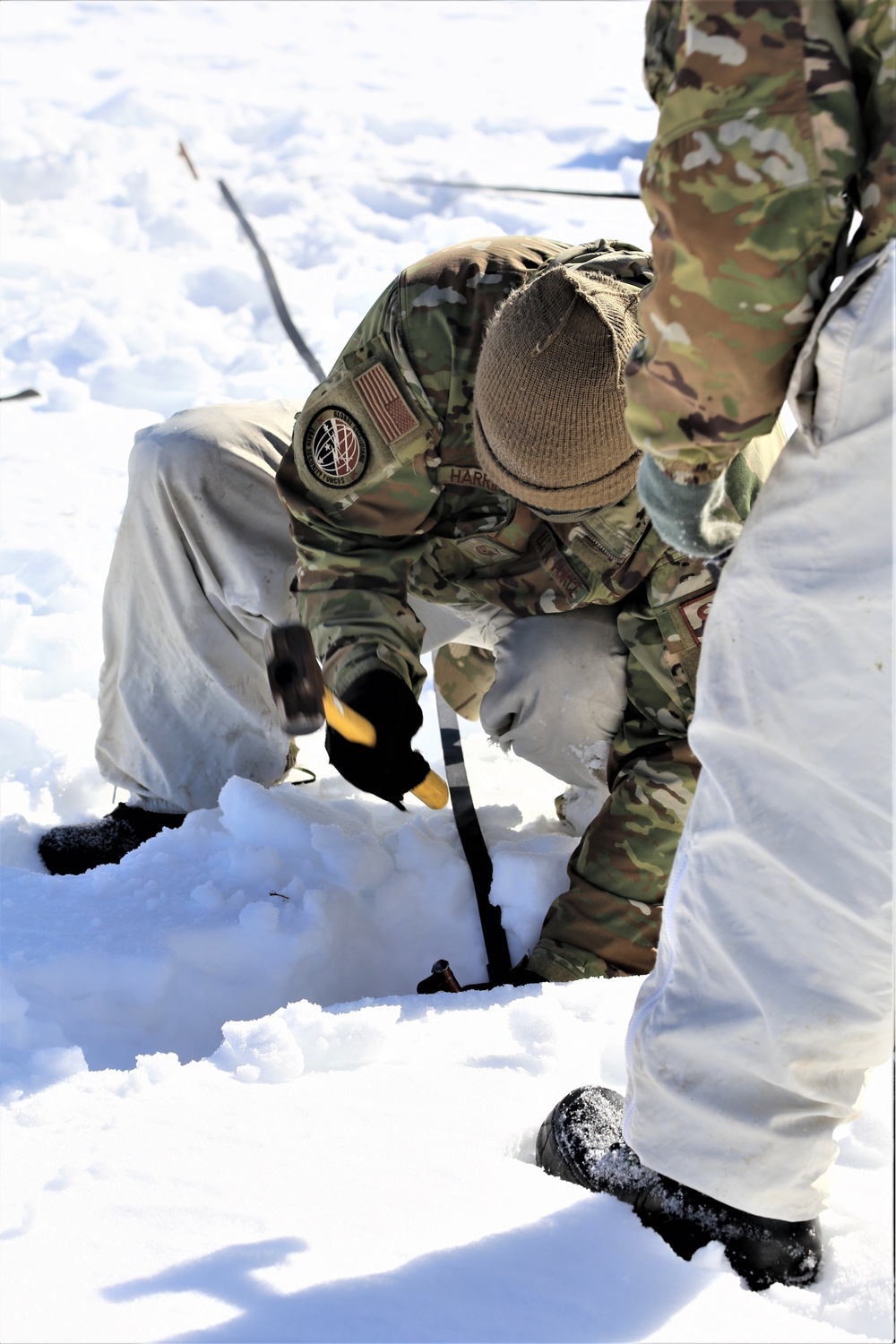 Cold-Weather Operations Course students practice building Arctic tent