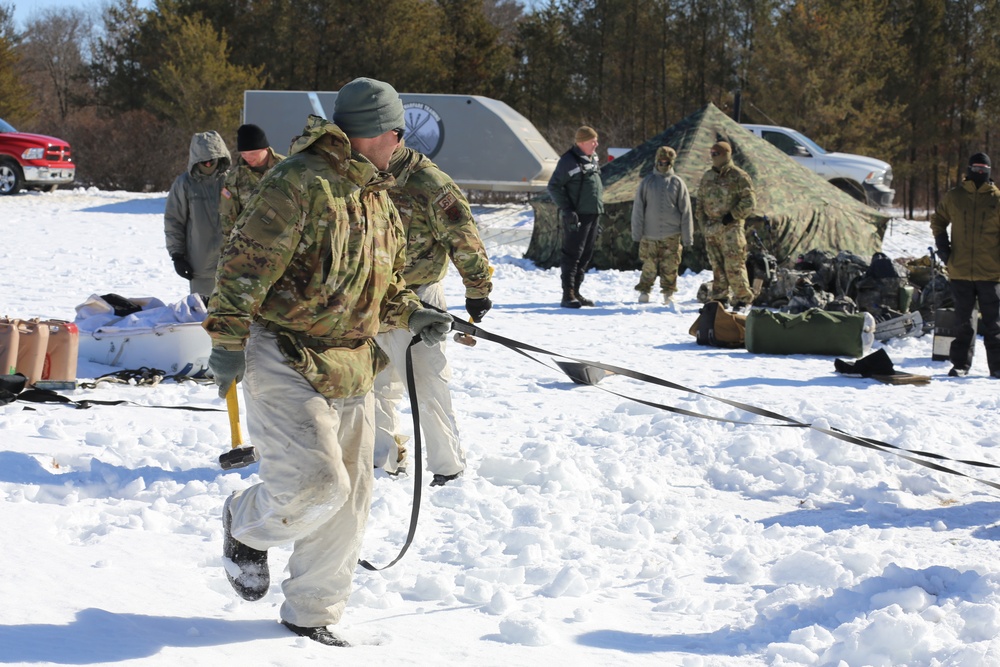 Cold-Weather Operations Course students practice building Arctic tent