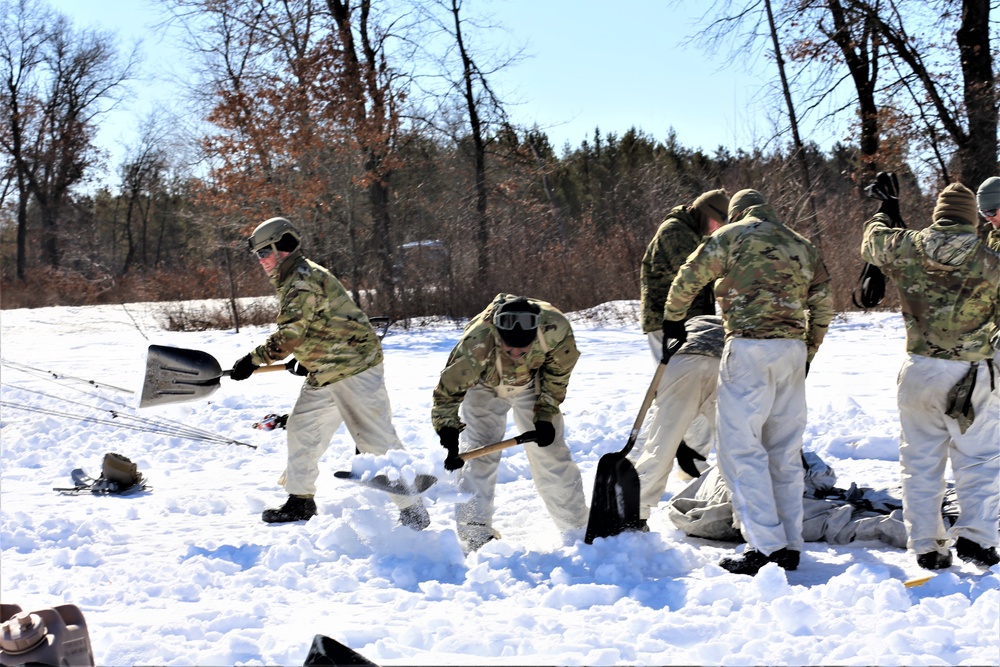 Cold-Weather Operations Course students practice building Arctic tent