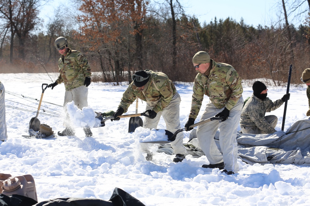 Cold-Weather Operations Course students practice building Arctic tent