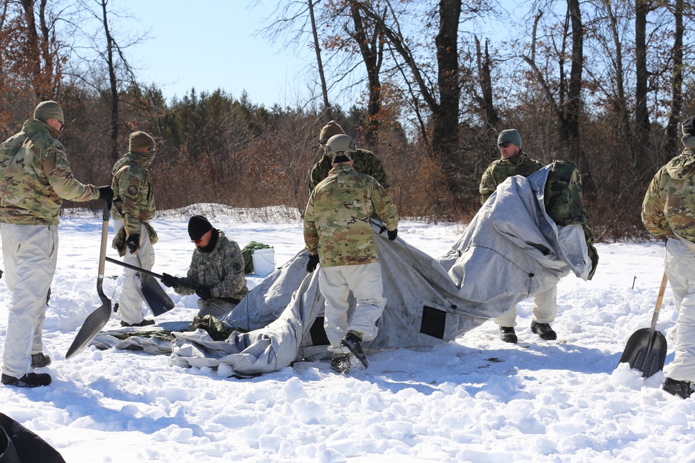 Cold-Weather Operations Course students practice building Arctic tent