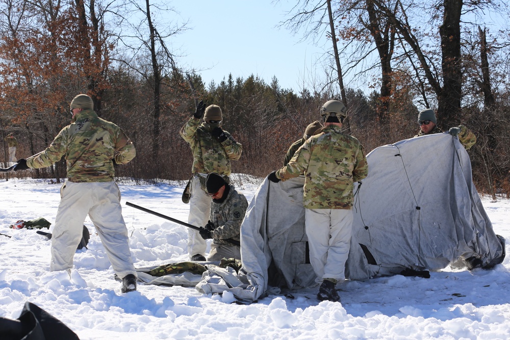 Cold-Weather Operations Course students practice building Arctic tent