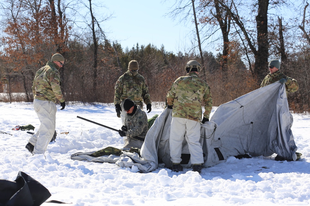 Cold-Weather Operations Course students practice building Arctic tent