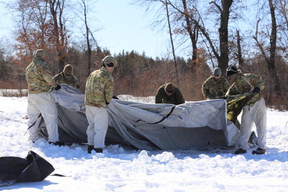 Cold-Weather Operations Course students practice building Arctic tent