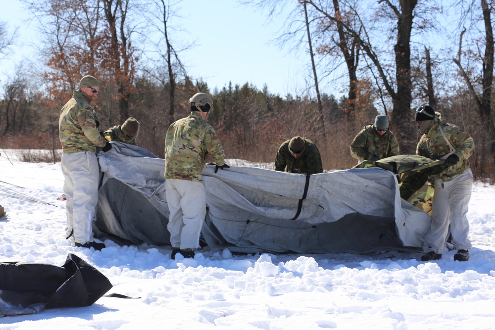 Cold-Weather Operations Course students practice building Arctic tent