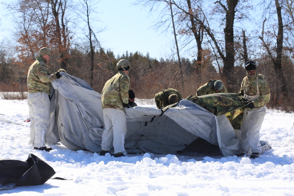 Cold-Weather Operations Course students practice building Arctic tent