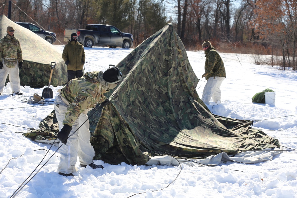 Cold-Weather Operations Course students practice building Arctic tent