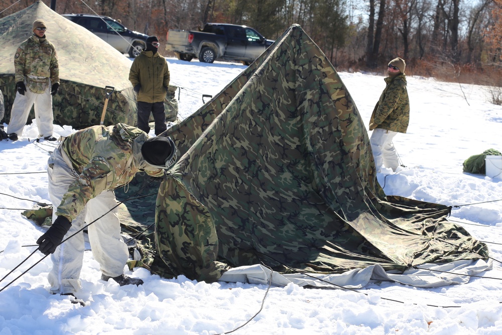 Cold-Weather Operations Course students practice building Arctic tent