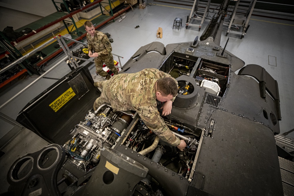 U.S. Army National Guard Soldiers perform phase maintenance on a UH-60L Black Hawk helicopter.