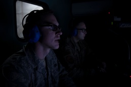 Airmen from the 192nd Wing and 1st Fighter Wing work together in a Hush House
