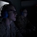Airmen from the 192nd Wing and 1st Fighter Wing work together in a Hush House