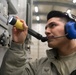 Airmen from the 192nd Wing and 1st Fighter Wing work together in a hush house