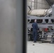 Airmen from the 192nd Wing and 1st Fighter Wing work together in a hush house