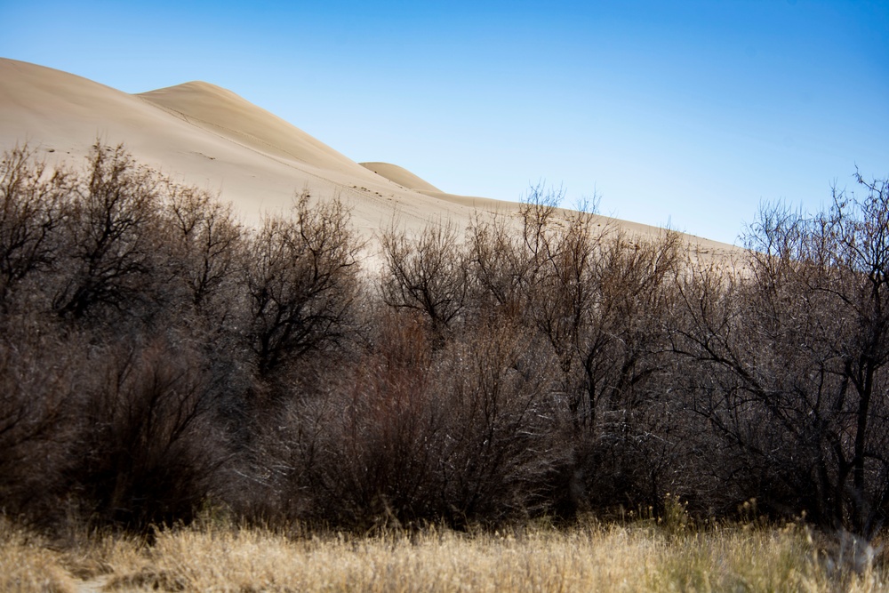 Airmen ruck 26 miles in sand dunes to tribute the Bataan Death March