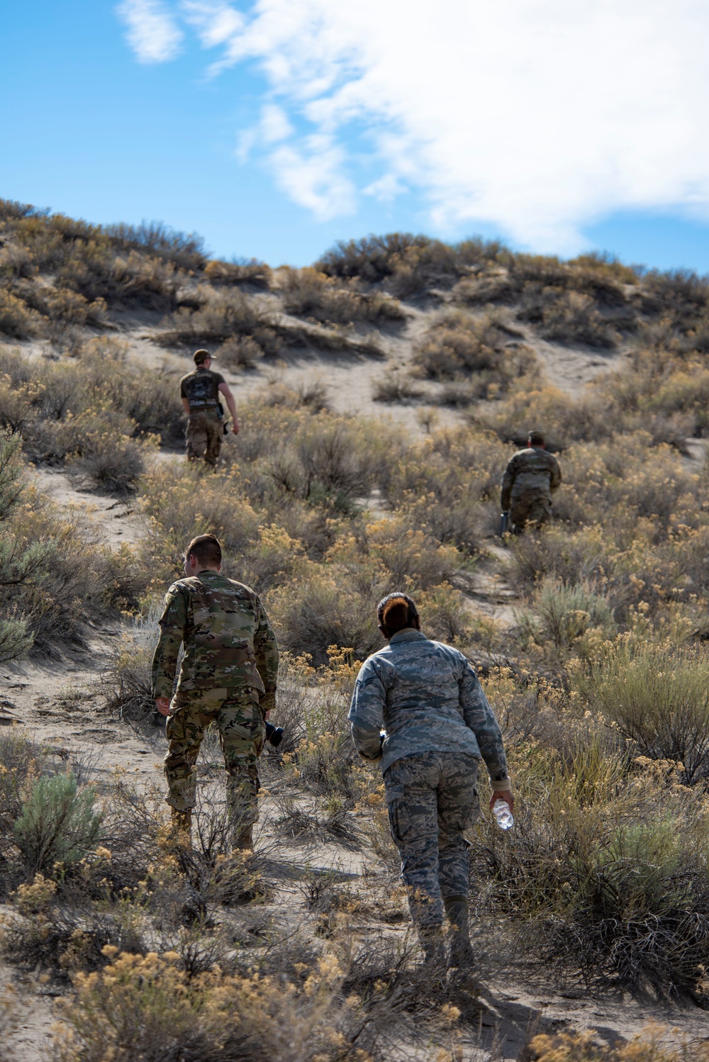 Airmen ruck 26 miles in sand dunes to tribute the Bataan Death March