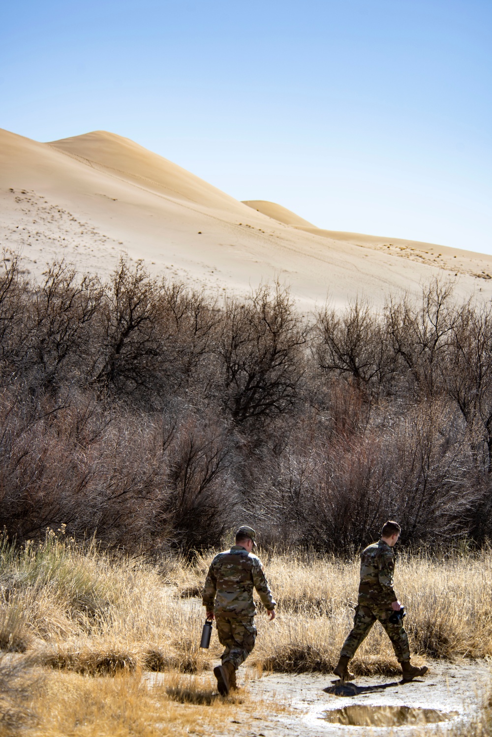 Airmen ruck 26 miles in sand dunes to tribute the Bataan Death March