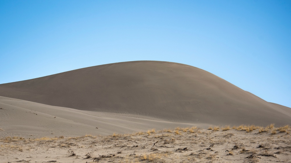 Airmen ruck 26 miles in sand dunes to tribute the Bataan Death March