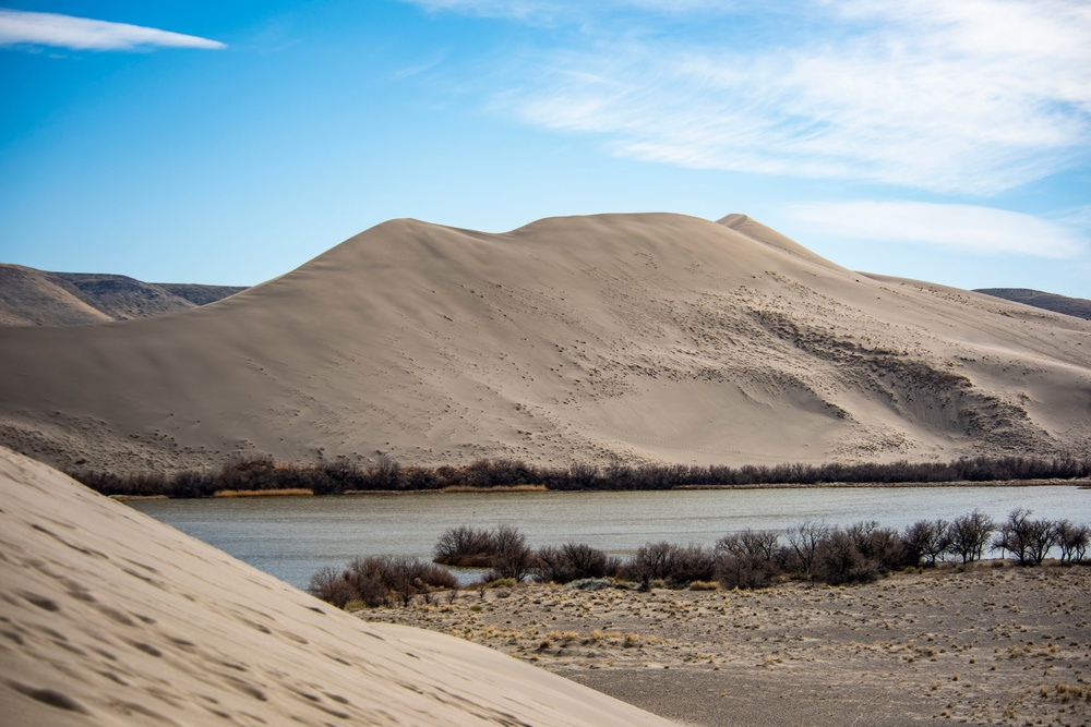 Airmen ruck 26 miles in sand dunes to tribute the Bataan Death March