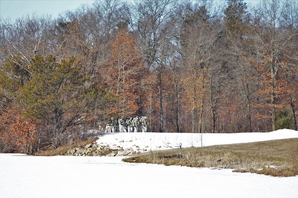 Fort McCoy Cold-Weather Operations Course students practice snowshoeing, ahkio sled use