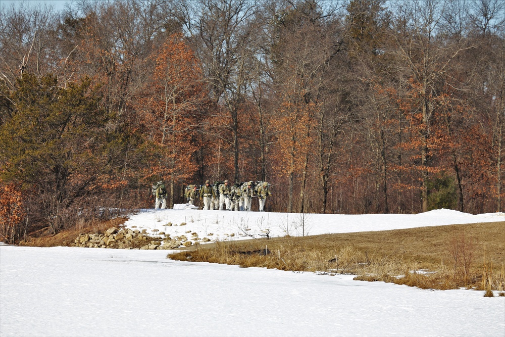 Fort McCoy Cold-Weather Operations Course students practice snowshoeing, ahkio sled use