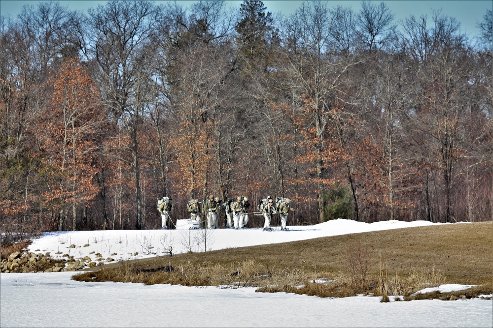 Fort McCoy Cold-Weather Operations Course students practice snowshoeing, ahkio sled use