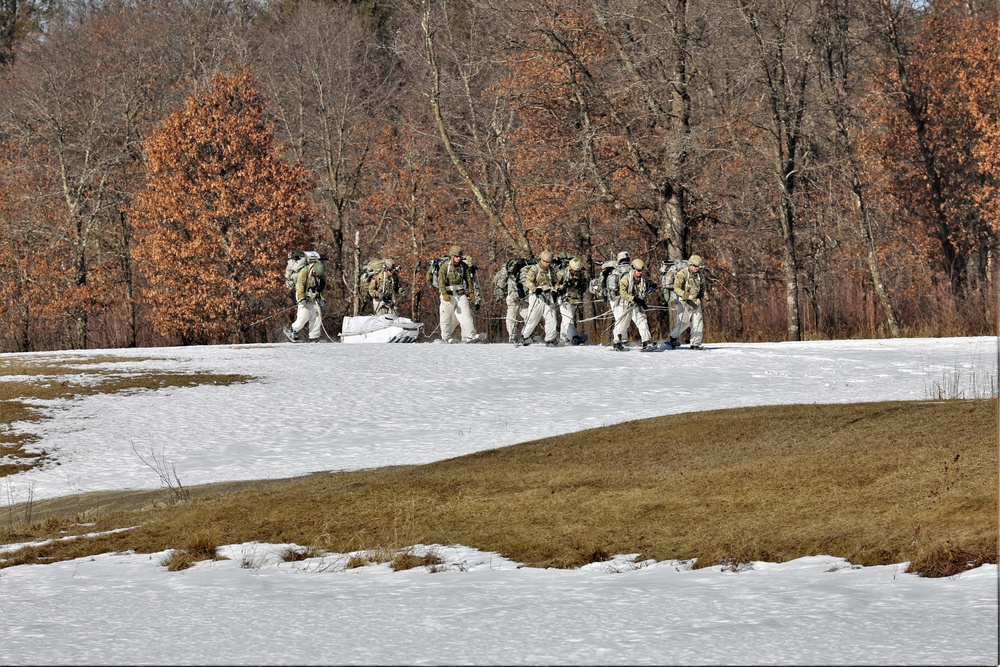 Fort McCoy Cold-Weather Operations Course students practice snowshoeing, ahkio sled use