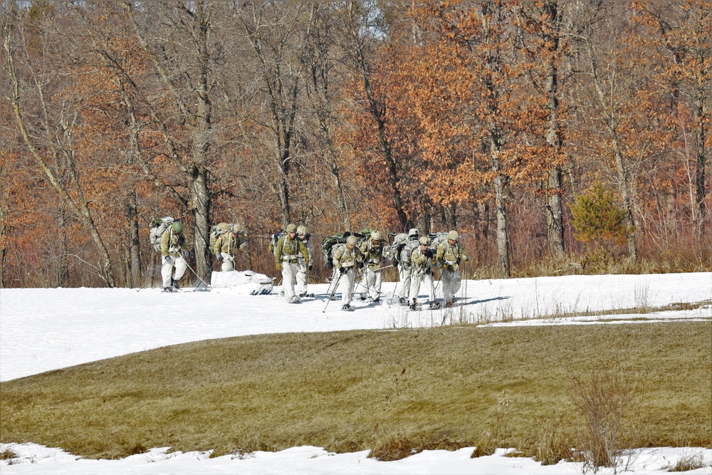 Fort McCoy Cold-Weather Operations Course students practice snowshoeing, ahkio sled use