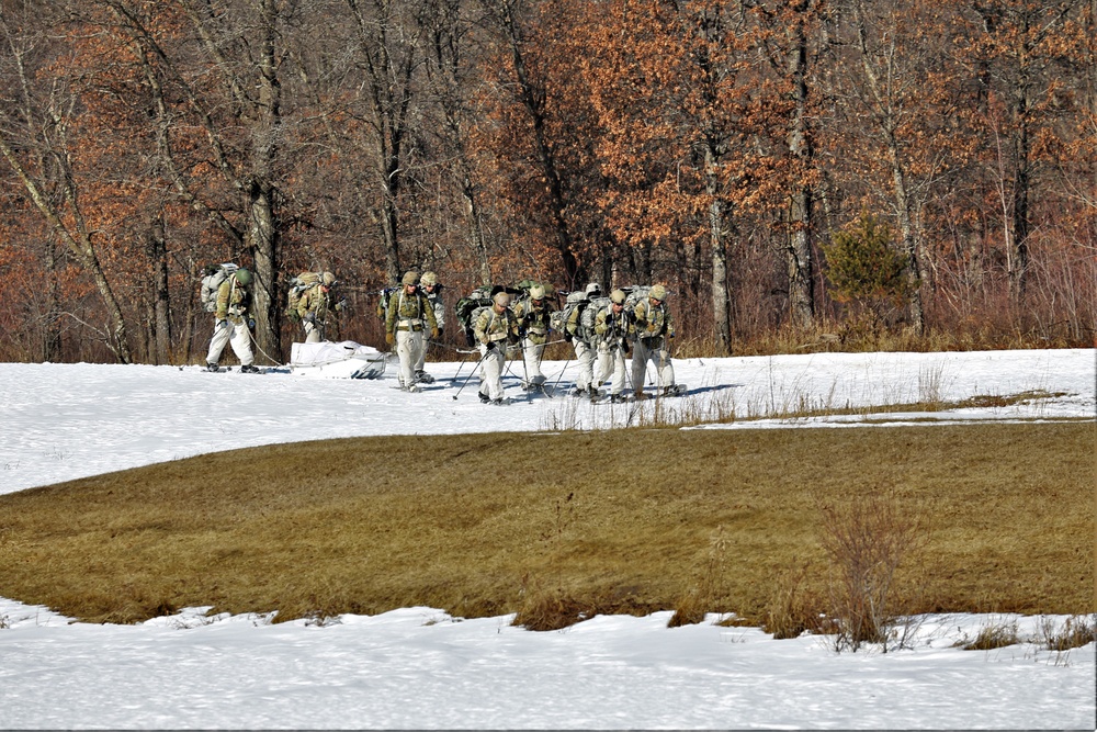 Fort McCoy Cold-Weather Operations Course students practice snowshoeing, ahkio sled use