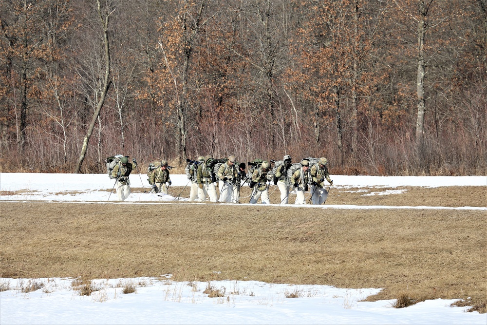 Fort McCoy Cold-Weather Operations Course students practice snowshoeing, ahkio sled use