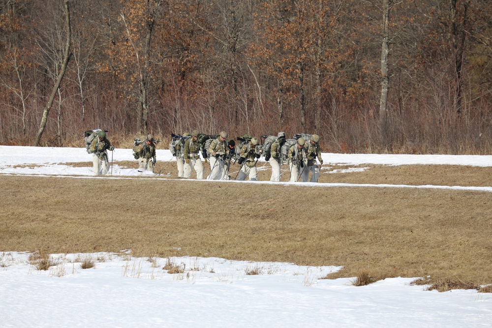 Fort McCoy Cold-Weather Operations Course students practice snowshoeing, ahkio sled use