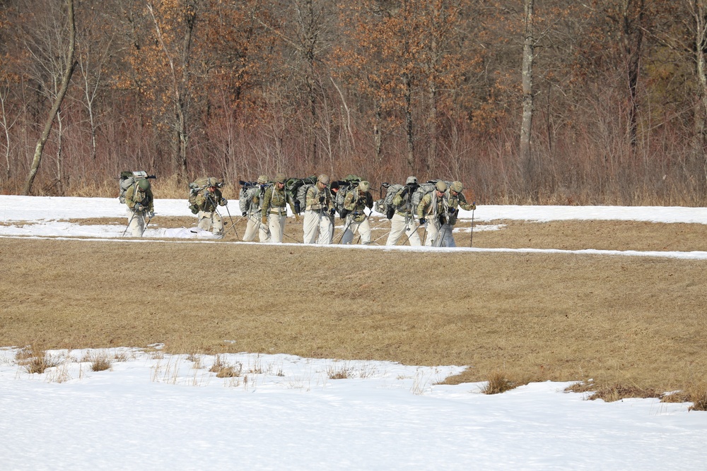 Fort McCoy Cold-Weather Operations Course students practice snowshoeing, ahkio sled use