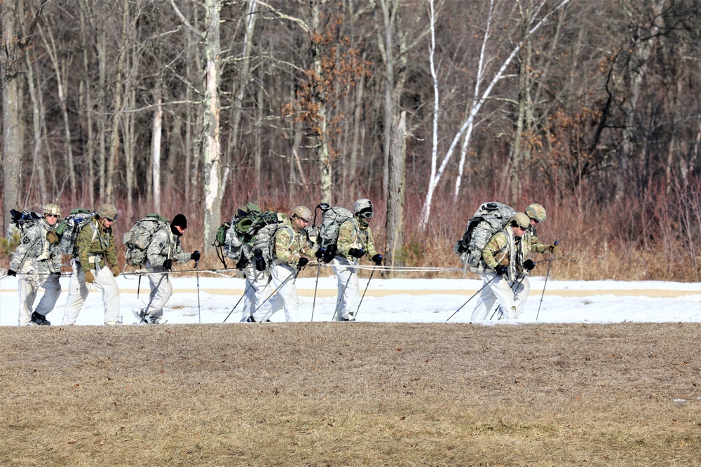 Fort McCoy Cold-Weather Operations Course students practice snowshoeing, ahkio sled use