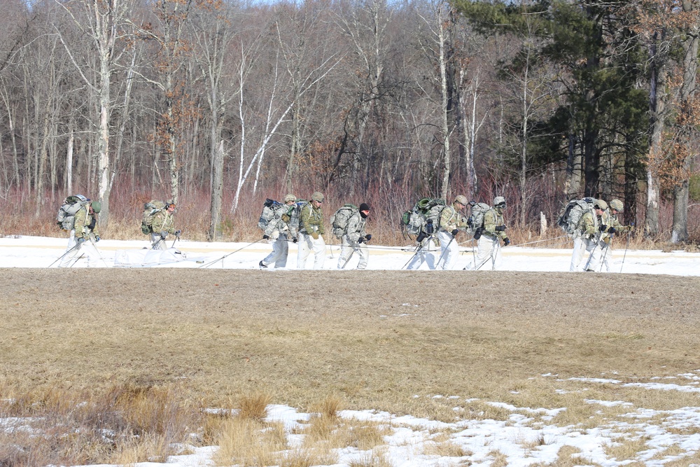 Fort McCoy Cold-Weather Operations Course students practice snowshoeing, ahkio sled use