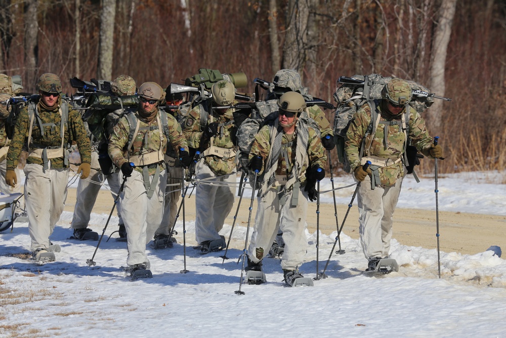 Fort McCoy Cold-Weather Operations Course students practice snowshoeing, ahkio sled use