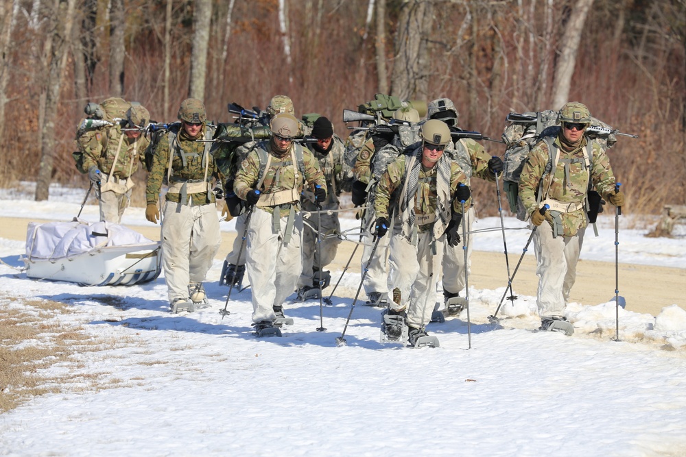 Fort McCoy Cold-Weather Operations Course students practice snowshoeing, ahkio sled use