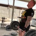 Sgt. Geoffrey Hanscom conducts a deadlift while training for the 1000 Pound Club.