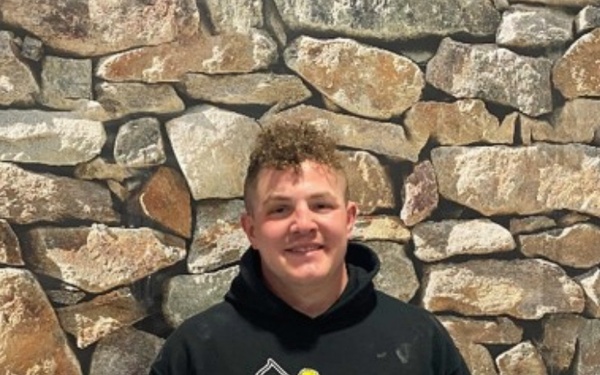 Spc. Sam Larson of the 3rd Battalion, 6th Field Artillery Regiment after earning a spot in the 1000 Pound Club.