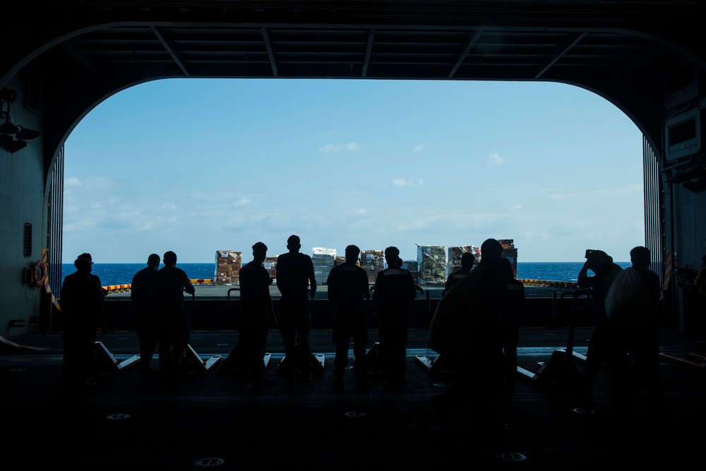 31st MEU Marines, USS America Sailors conduct replenishment at sea