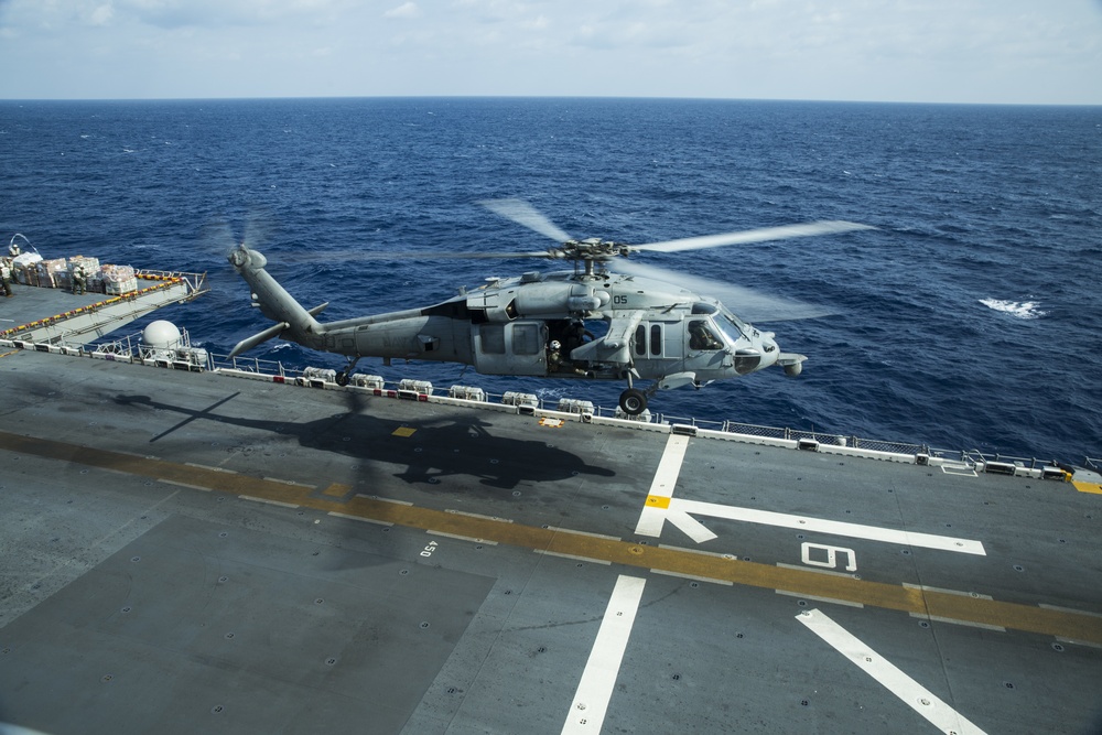 31st MEU Marines, USS America Sailors conduct replenishment at sea