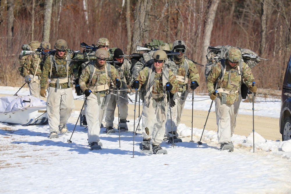 Fort McCoy Cold-Weather Operations Course students practice snowshoeing, ahkio sled use