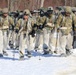 Fort McCoy Cold-Weather Operations Course students practice snowshoeing, ahkio sled use