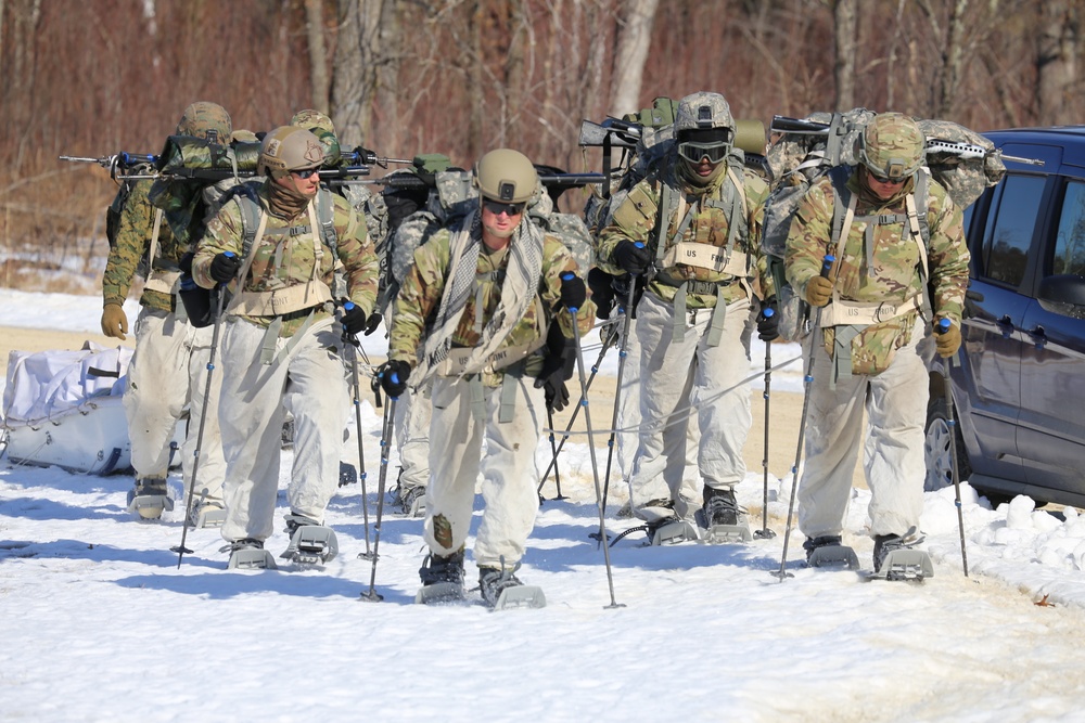 Fort McCoy Cold-Weather Operations Course students practice snowshoeing, ahkio sled use