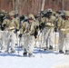 Fort McCoy Cold-Weather Operations Course students practice snowshoeing, ahkio sled use