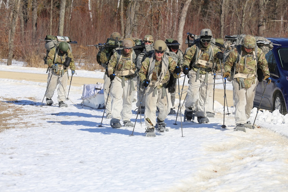 Fort McCoy Cold-Weather Operations Course students practice snowshoeing, ahkio sled use