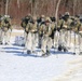 Fort McCoy Cold-Weather Operations Course students practice snowshoeing, ahkio sled use